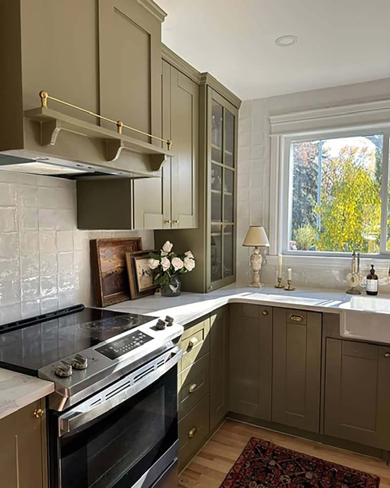 Olive green painted cabinets in newly renovated kitchen.