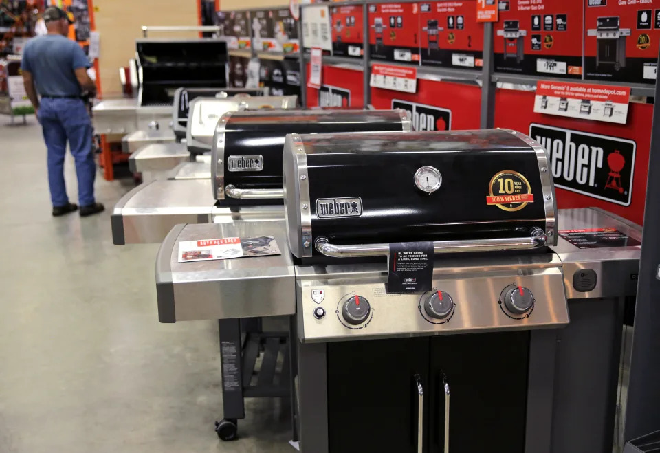 FILE - In this July 11, 2019, file photo Weber grills are displayed at the Home Depot store in Londonderry, N.H. The Home Depot Inc. on Tuesday, Aug. 20, reported fiscal second-quarter net income of $3.48 billion.  (AP Photo/Charles Krupa, File)