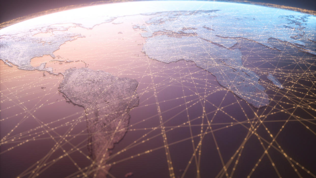  Animated aerial view of the earth showing satellite data connections as yellow lines around the planet. 