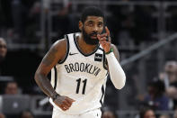 Brooklyn Nets guard Kyrie Irving (11) reacts after a basket in overtime of an NBA basketball game against the Detroit Pistons in Detroit, Saturday, Jan. 25, 2020. Brooklyn won 121-111. (AP Photo/Paul Sancya)