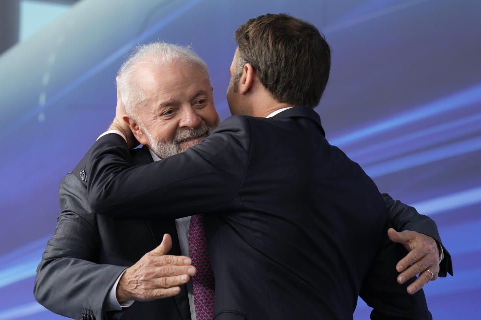 France's President Emmanuel Macron, right, hugs Brazilian President Luiz Inacio Lula da Silva during the launch ceremony of the Tonelero submarine constructed in Brazil with French technology in Itaguai, Rio de Janeiro state, Brazil, Wednesday, March 27, 2024. Macron is on a three-day visit to Brazil. (AP Photo/Silvia Izquierdo)