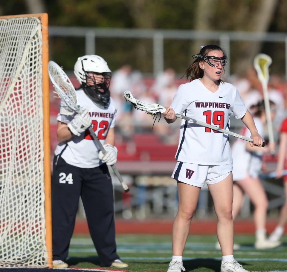 Wappingers goalkeeper Emma Martin and defender Kathleen Ninos track the offense during an April 25, 2024 girls lacrosse game against Tappan Zee.