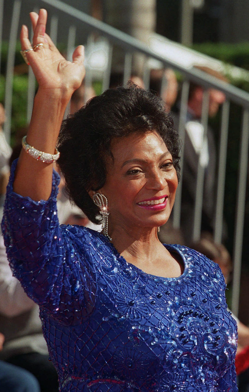 FILE - Actor Nichelle Nichols, who played Lt. Ntoya Uhura on ''Star Trek,'' waves as she arrives at the "Star Trek: 30 Years and Beyond" tribute at Paramount Studios in Los Angeles, Sunday, Oct. 6, 1996. Nichols died Saturday, July 30, 2022, her family said. She was 89. (AP Photo/Damian Dovarganes, File)