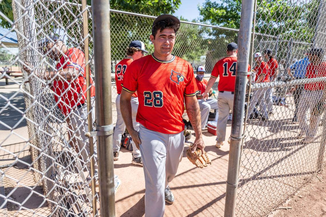 Jorge Gil Laguna, one of the immigrants that was flown to Sacramento last year, walks to the pitcher’s mound during his first game in the Sacramento Men’s Senior Baseball League earlier this month.