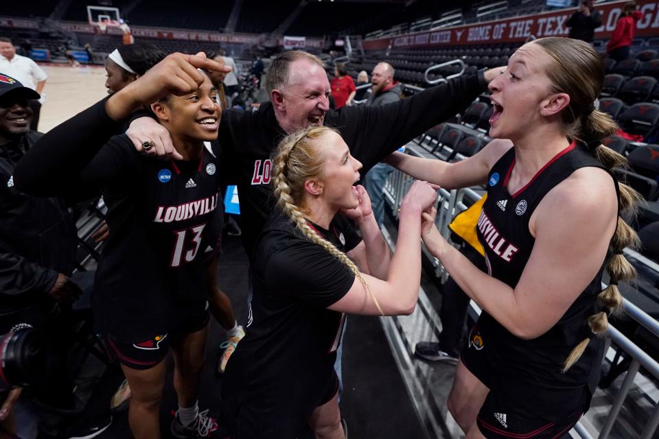 Louisville guard Merissah Russell (13), guard Hailey Van Lith, center, and center Josie Williams, right, celebrate with fans after the team's win over Texas in a second-round college basketball game in the NCAA Tournament in Austin, Texas, Monday, March 20, 2023. (AP Photo/Eric Gay)