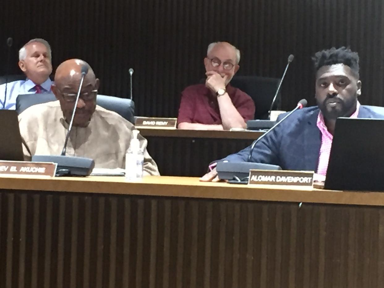 Mansfield City Councilman Alomar Davenport, right, listens during a finance committee meeting Tuesday night, ahead of the regular session. Seated to his right is Councilman El Akuchie.