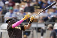 San Diego Padres' Fernando Tatis Jr. (23) pops out to second base during the first inning of a spring training baseball game against the Los Angeles Dodgers in Glendale, Calif., Monday, March 6, 2023. (AP Photo/Ashley Landis)