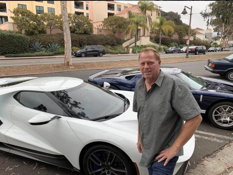 Meghan Markle's estranged half-brother Thomas Markle Jr. poses in front of a car
