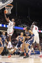 Alabama guard Jaden Bradley (0) lays up a shot against Gonzaga during the first half of an NCAA college basketball game, Saturday, Dec. 17, 2022, in Birmingham, Ala. (AP Photo/Vasha Hunt)