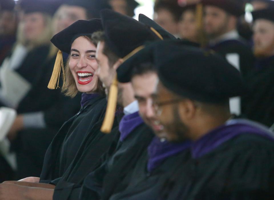 Louise El Yafi celebrates with classmates at the conclusion of the Widener University Delaware Law School commencement for 179 graduates in its 43rd graduating class on Saturday.