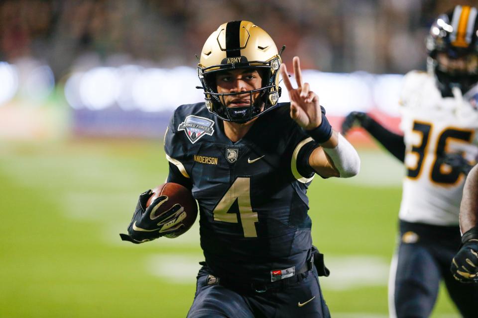 Dec 22, 2021; Fort Worth, Texas, USA; Army Black Knights quarterback Christian Anderson (4) scores a touchdown against the Missouri Tigers during the second quarter of the 2021 Armed Forces Bowl at Amon G. Carter Stadium.