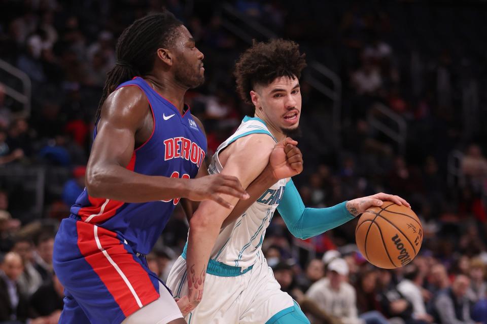 Charlotte Hornets guard LaMelo Ball tries to drive around Detroit Pistons' Isaiah Stewart during the second half at Little Caesars Arena on Jan. 24, 2024 in Detroit.