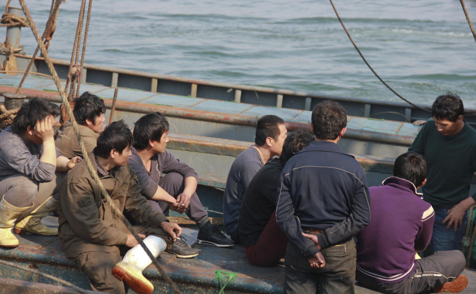 In this Monday May 21, 2012 photo, Chinese fishing crew members rest on their boat on the way back home after 13 days in North Korean custody at a harbor in Dalian, in northeastern China's Liaoning province. China's leadership is hitting a rough patch with ally North Korea under its new leader Kim Jong Un, as Beijing finds itself wrong-footed in episodes including Pyongyang's rocket launch and the murky detention of Chinese fishing boats. (AP Photo) CHINA OUT