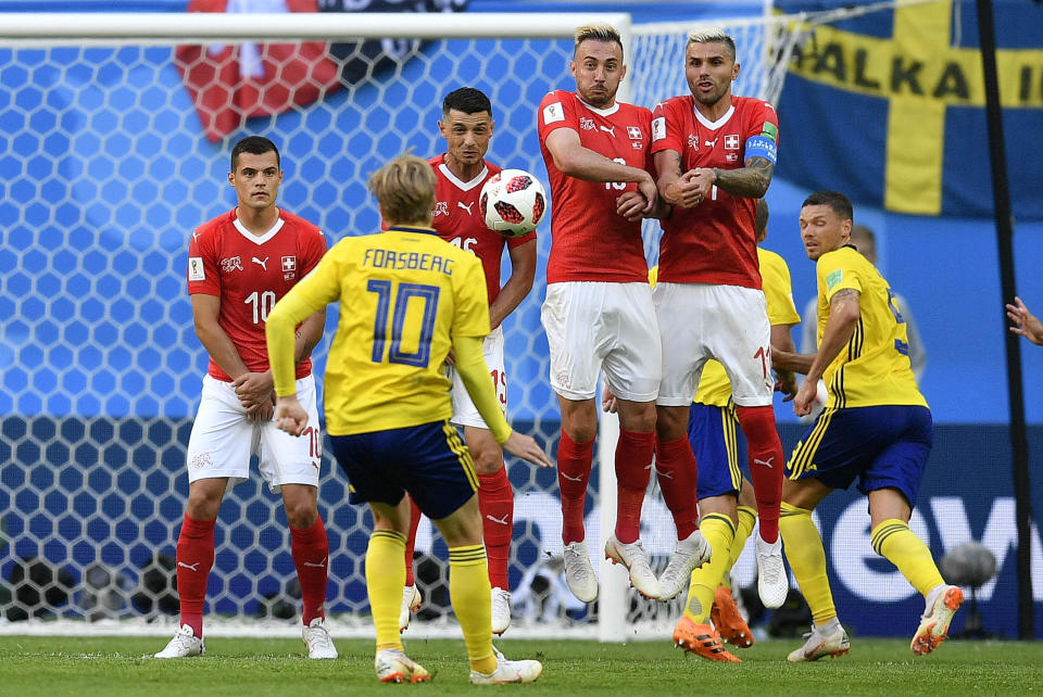 <p>Sweden’s Emil Forsberg kicks a free kick during the round of 16 match between Switzerland and Sweden at the 2018 soccer World Cup in the St. Petersburg Stadium, in St. Petersburg, Russia, Tuesday, July 3, 2018. (AP Photo/Martin Meissner) </p>