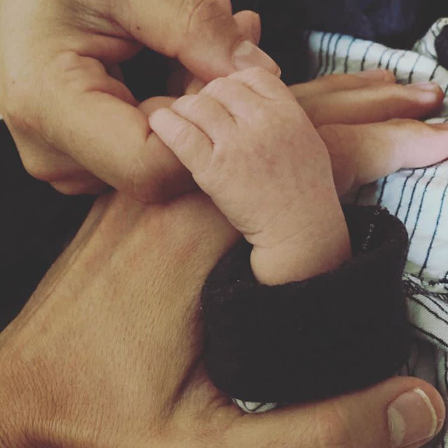 Nikki Bella gave birth to her first child with fiancé Artem Chigvintsev on Friday, July 31, 2020. Nikki captioned the sweet pic of Artem and their baby holding hands: "Our baby boy is here and we couldn’t be HAPPIER and more in LOVE! Everyone is safe and healthy." But that wasn't the only exciting news in the Bella family.