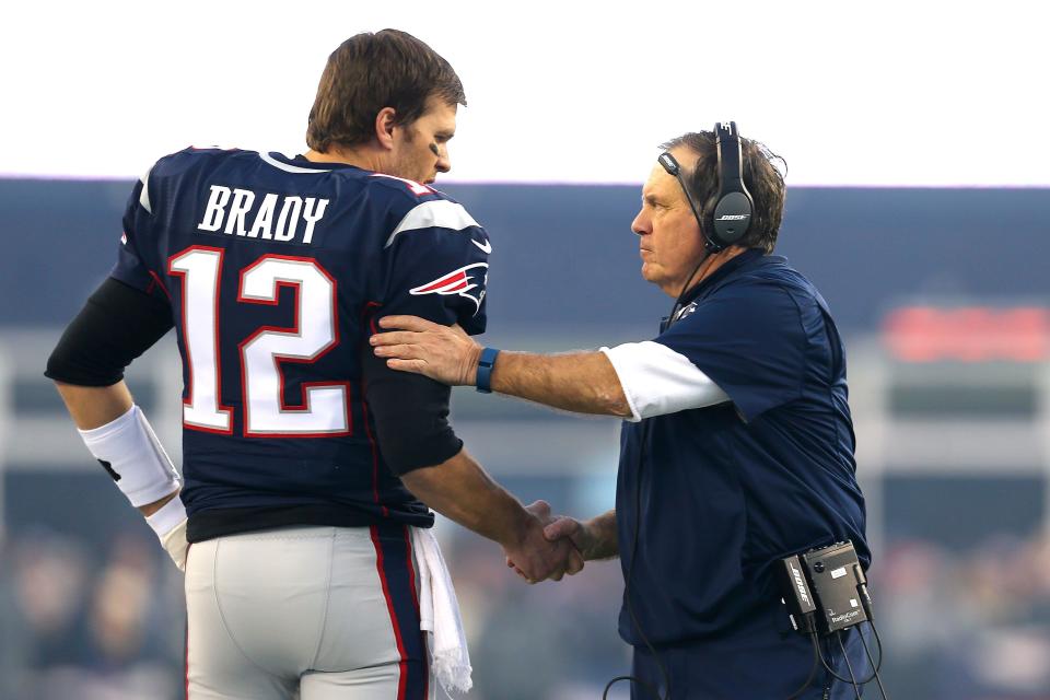 FOXBORO, MA - JANUARY 16: Tom Brady #12 and head coach Bill Belichick of the New England Patriots shake hands at the start of the AFC Divisional Playoff Game against the Kansas City Chiefs at Gillette Stadium on January 16, 2016 in Foxboro, Massachusetts.  (Photo by Maddie Meyer/Getty Images)