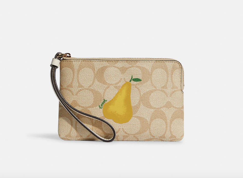 Coach Outlet Corner Zip Wristlet In Signature Canvas With Pear (Photo via Coach Outlet)