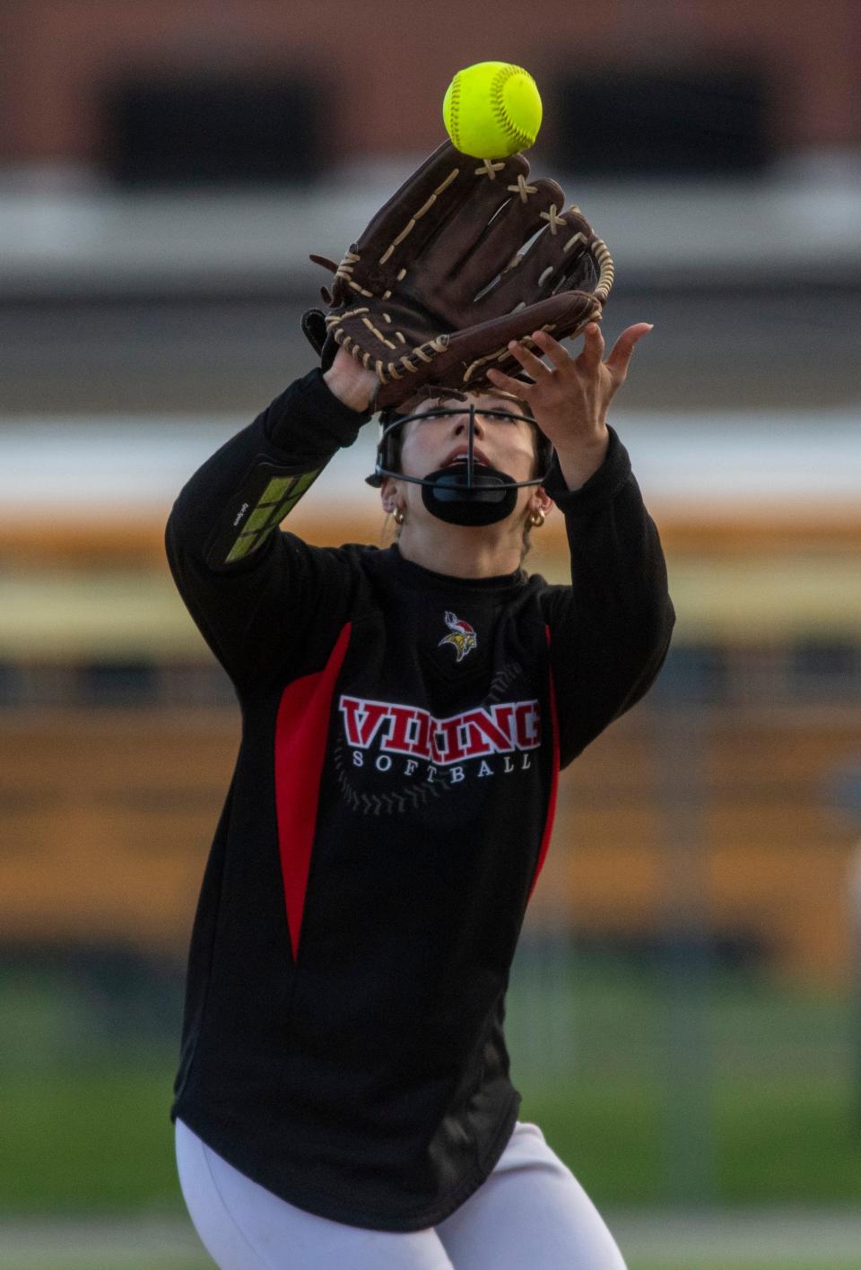 North Posey’s Ashton Elpers (20) catches the ball as the Henderson County Lady Colonels play the North Posey Lady Vikings in Henderson, Ky., Tuesday, March 26, 2024.