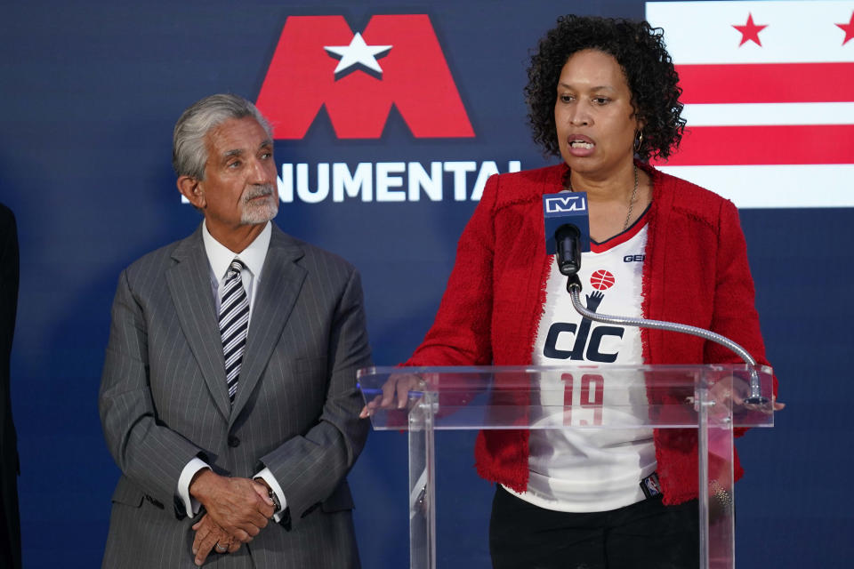 Washington DC Mayor Muriel Bowser, right, speaks during a news conference with Ted Leonsis, owner of the Washington Wizards NBA basketball team and Washington Capitals NHL hockey team at Capitol One Arena in Washington, Wednesday, March 27, 2024. (AP Photo/Stephanie Scarbrough)