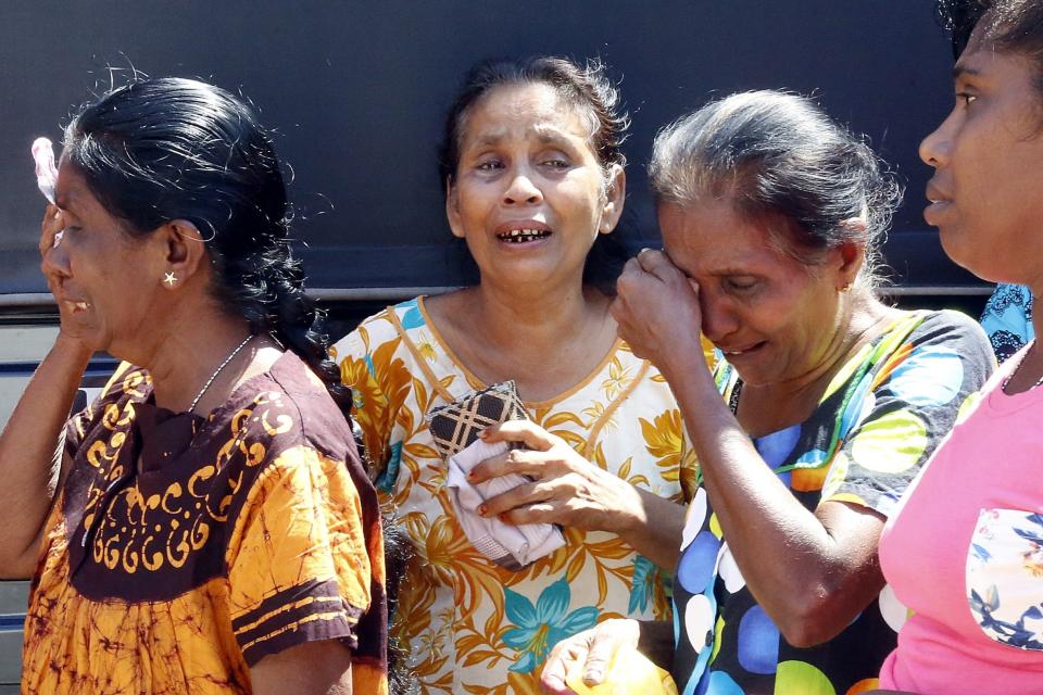 Devastated relatives weep after a series of blasts in Colombo, Sri Lanka, killed almost 300 (EPA)