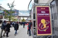 Oct 25, 2016; Cleveland, OH, USA; Fans walk past a Cleveland Cavaliers championship banner before game one of the 2016 World Series between the Chicago Cubs and the Cleveland Indians at Progressive Field. Mandatory Credit: Ken Blaze-USA TODAY Sports
