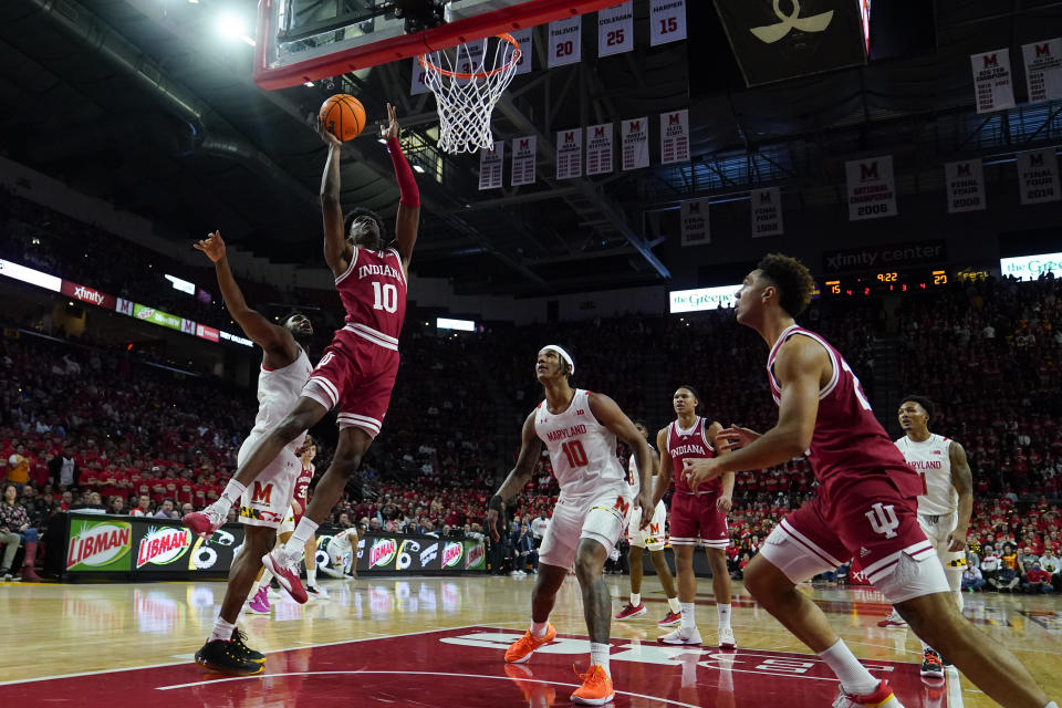 Indiana forward Kaleb Banks, second from left, goes up for a basket against Maryland forward Donta Scott, left, during the first half of an NCCA college basketball game, Tuesday, Jan. 31, 2023, in College Park, Md. (AP Photo/Julio Cortez)