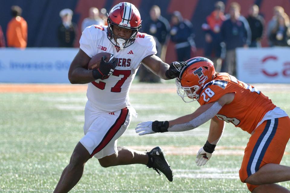 Nov 11, 2023; Champaign, Illinois, USA; Indiana Hoosiers running back Trent Howland is pursued by Illinois Fighting Illini linebacker Dylan Rosiek (28) during the second half at Memorial Stadium. Mandatory Credit: Ron Johnson-USA TODAY Sports