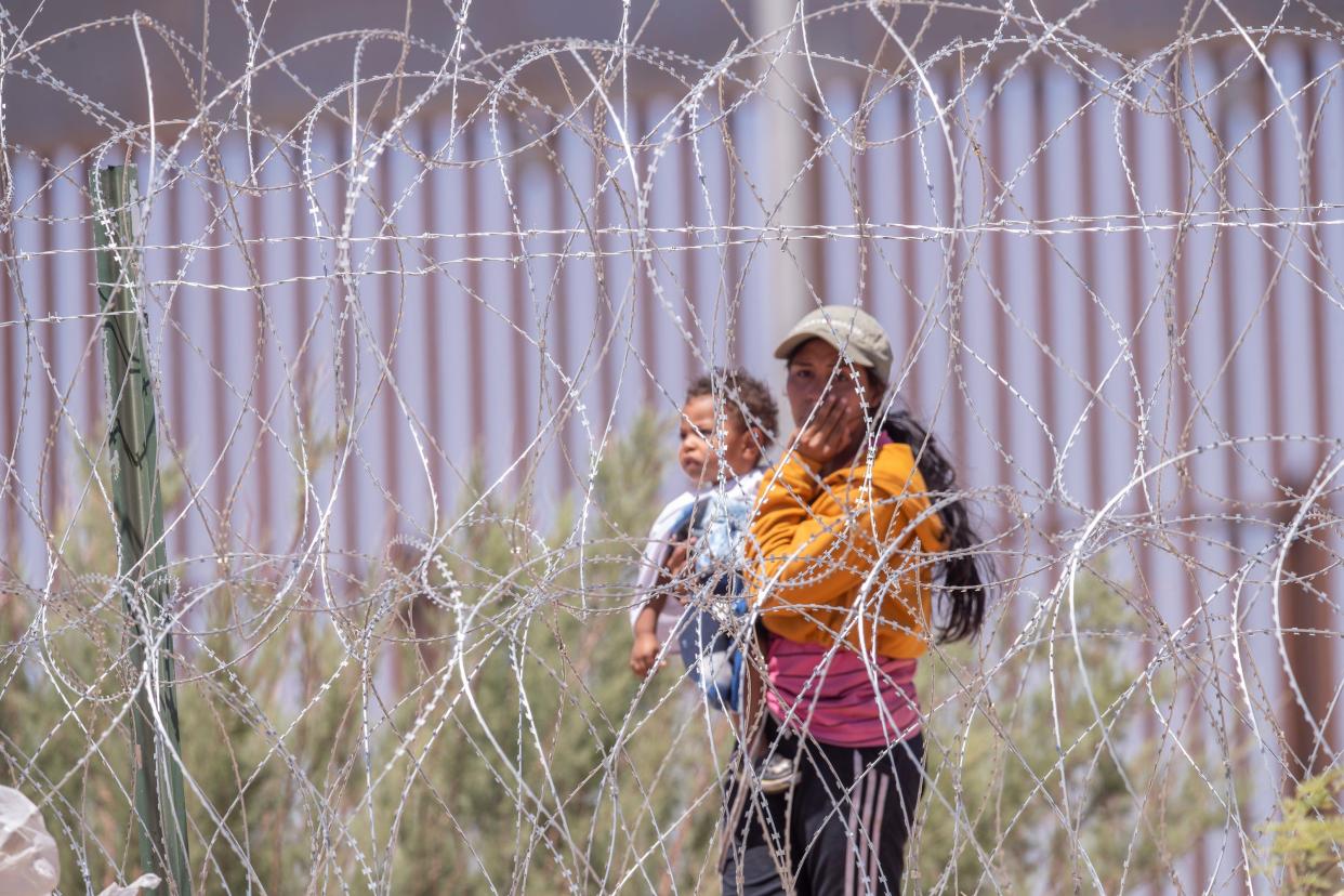 A woman cries after her husband is not let inside gate 42 where migrants assembled to surrender to Customs and Border Protection in El Paso, Texas on Thursday, May 11, 2023, on the last day before Title 42 was to be lifted.