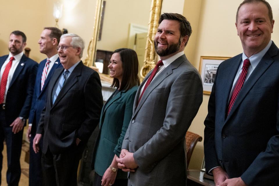 Markwayne Mullin, Ted Budd, Mitch McConnell, Katie Britt, JD Vance, and Eric Schmit pose for a photo