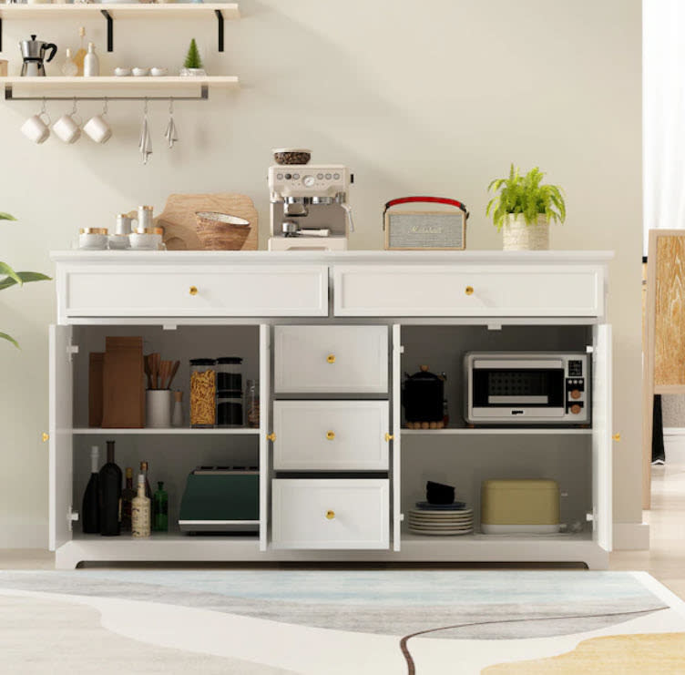 all white kitchen storage unit with multiple drawers and table top
