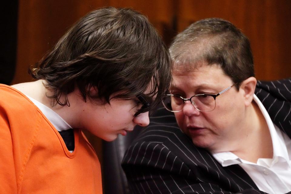 Ethan Crumbley talks with attorney Amy Hopp in court on Friday, July 28, 2023, in Pontiac, Mich. Prosecutors are making their case that the Michigan teenager should be sentenced to life in prison for killing four students at his high school in 2021. Prosecutors introduced dark journal entries written by Ethan Crumbley, plus chilling video and testimony from a wounded staff member.