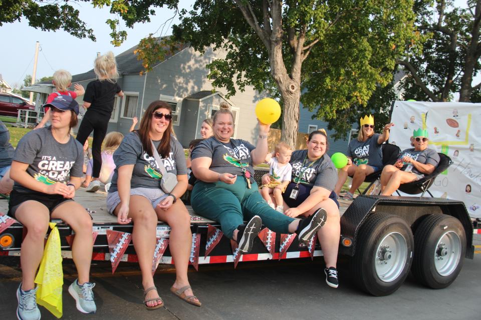 Woodward-Granger Middle School staff members throw candy during the homecoming parade on Thursday, Sept. 15, 2022, in Woodward.