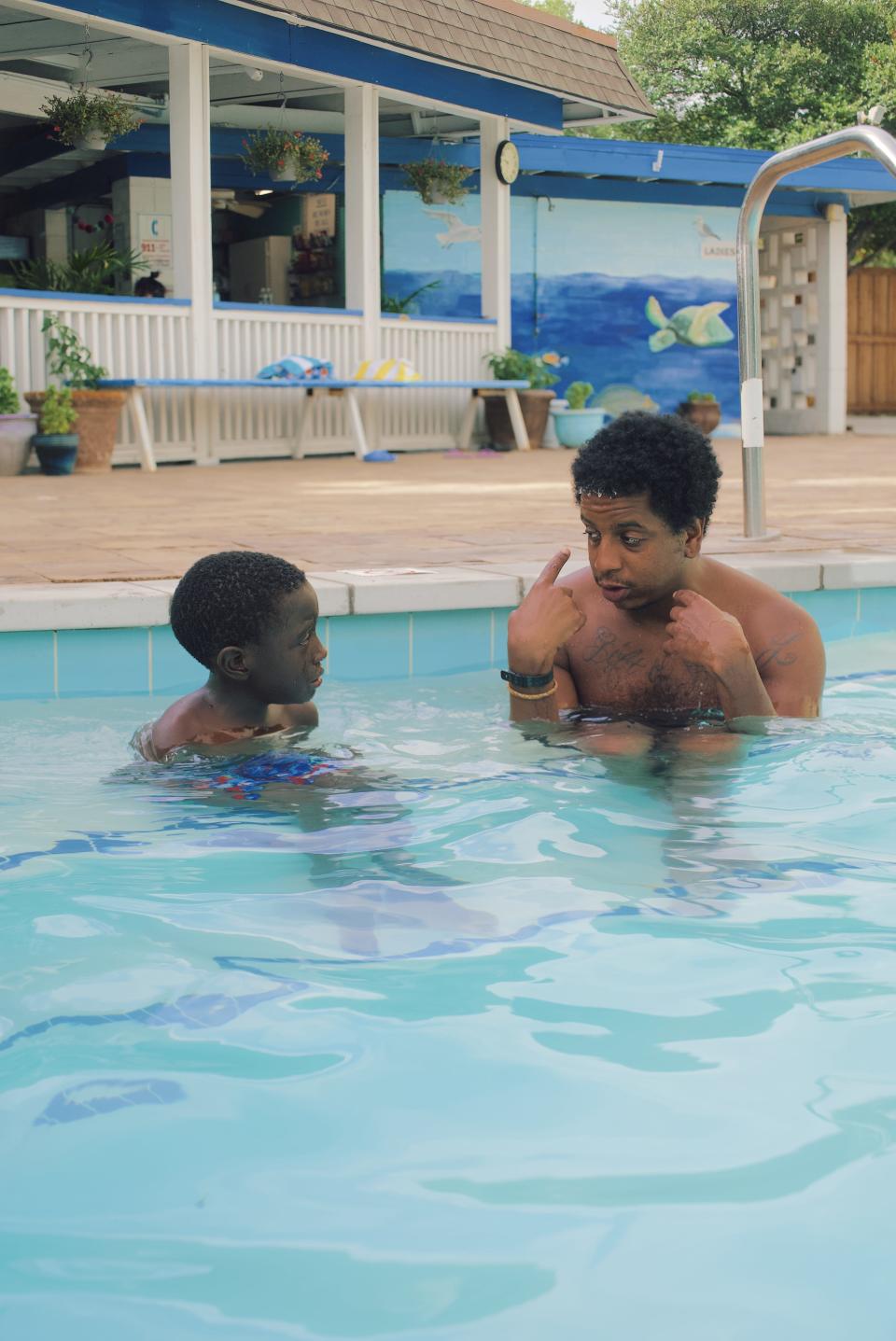 An instructor teaches a student how to swim as part of a program with Tankproof, which offers free swimming lessons to underserved communities in Seattle, San Francisco, Los Angeles, Dallas, Austin, Baton Rouge, Brooklyn and Nashville.