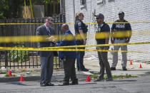 Baltimore Police investigate the scene of an officer involved shooting in the Shipley Hill neighborhood of Baltimore, Thursday afternoon, May 11, 2023. (Jerry Jackson/The Baltimore Sun via AP)