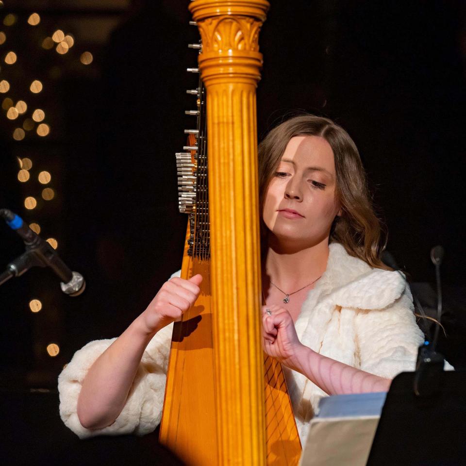 Harpist Joanna Seiber seems to be in the musical zone playing at Martin Center for the Arts. Johnson City, Dec. 2023.