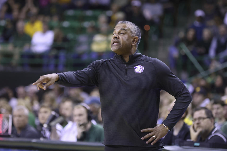 Kansas State head coach Jerome Tang calls in an offensive play in the first half of an NCAA college basketball game against Baylor, Saturday, Jan. 7, 2023, in Waco, Texas. (AP Photo/Rod Aydelotte)