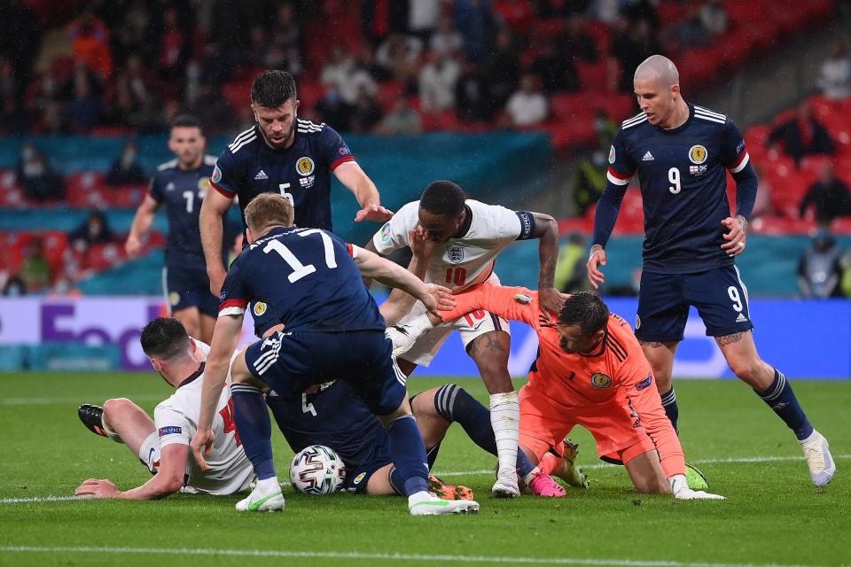 Raheem Sterling battles for possession with David Marshall (Getty)