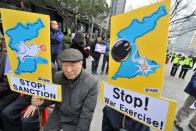 Anti-war activists protest against a joint military exercise between South Korea and the US, called Key Resolve, near the US embassy in Seoul on March 12, 2013. North Korea leader Kim Jong-Un threatened to "wipe out" a South Korean island as Pyongyang came under new economic and diplomatic fire from US sanctions and UN charges of gross rights abuses