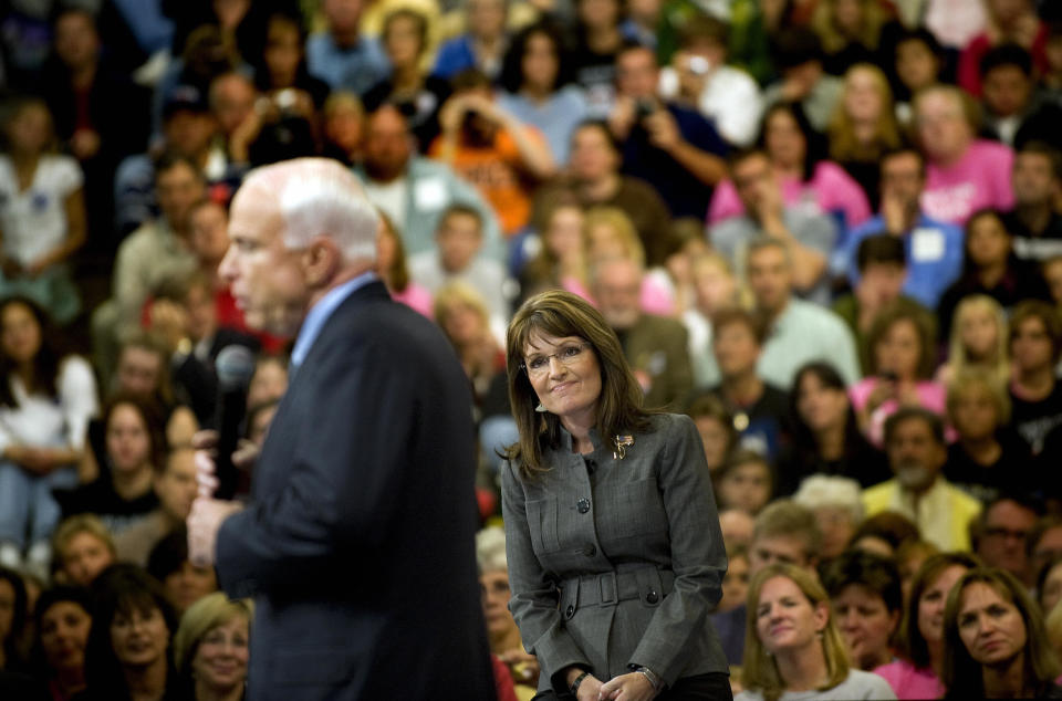 John McCain, 2008 Republican presidential candidate, and Sarah Palin, his vice presidential nominee, respond to angry supporters worried about "socialists taking over our country." (Photo: JIM WATSON via Getty Images)