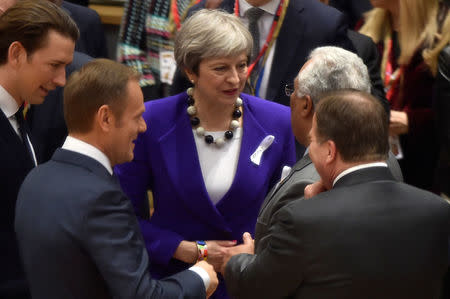 British Prime Minister Theresa May talks with Portuguese Prime Minister Antonio Costa as they attend a European Union leaders summit in Brussels, Belgium, March 22, 2018. REUTERS/Eric Vidal/Pool