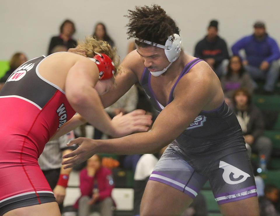 Barberton's Roosevelt Andrews, right, will be vying for a district title in a loaded 285-pound weight class this weekend at Hoover High School.