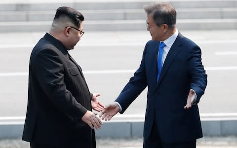 North Korean leader Kim Jong-un suggests Mr Moon crosses into the North - Credit: Bloomberg