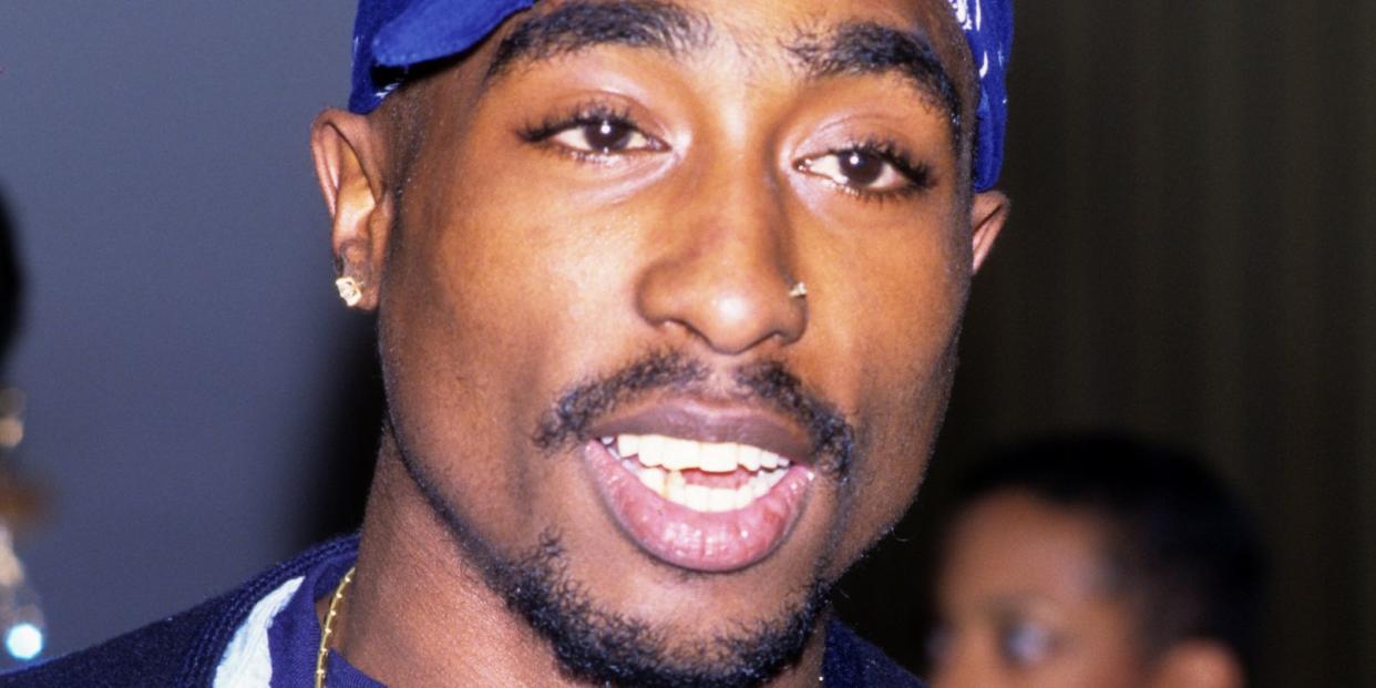 rapper and actor tupac shakur at a movie premiere in 1996 he is wearing his signature bandana around his head