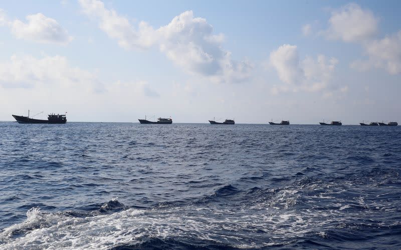 FILE PHOTO: Chinese boats fish at the disputed Scarborough Shoal