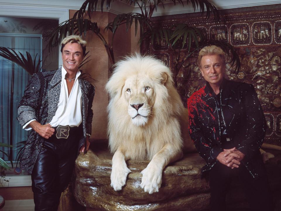 Siegfried Fischbacher and Roy Horn in their private apartment at the Mirage Hotel on the Vegas Strip, along with one of their performing white lions.