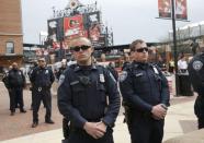 Police stand guard outside Camden Yards as protesters gathered for a rally to protest the death of Freddie Gray who died following an arrest in Baltimore, Maryland April 25, 2015. REUTERS/Shannon Stapleton