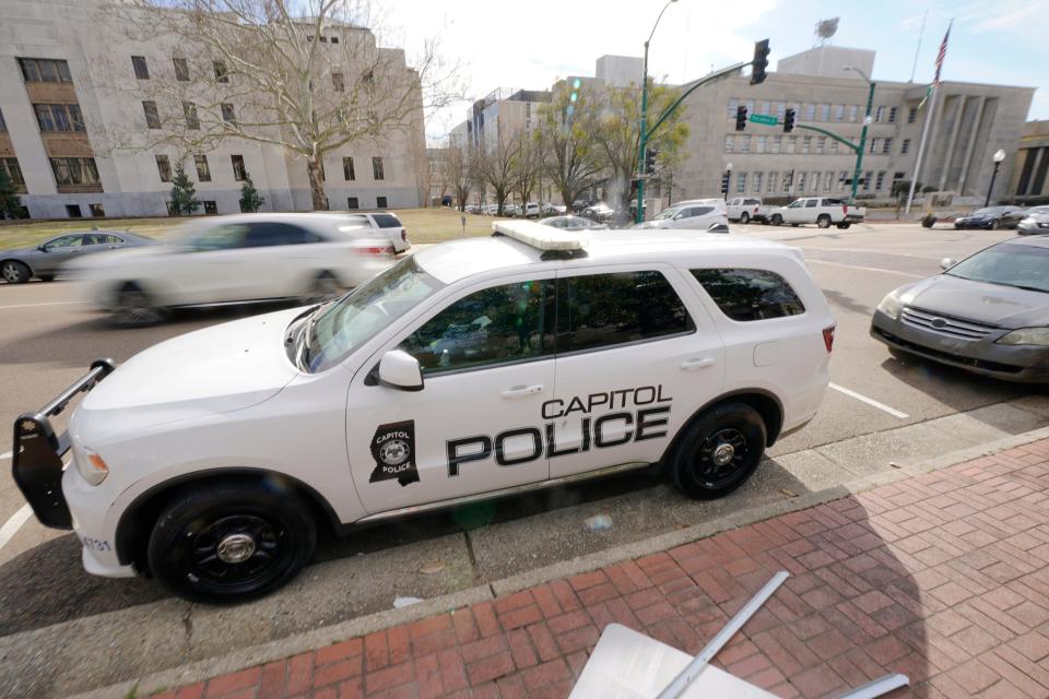 A Capitol Police SUV is parked across the street from the Hinds County Courthouse, left, and the main offices of the Jackson Police Department, right, in downtown Jackson, Miss., Feb. 13, 2023.