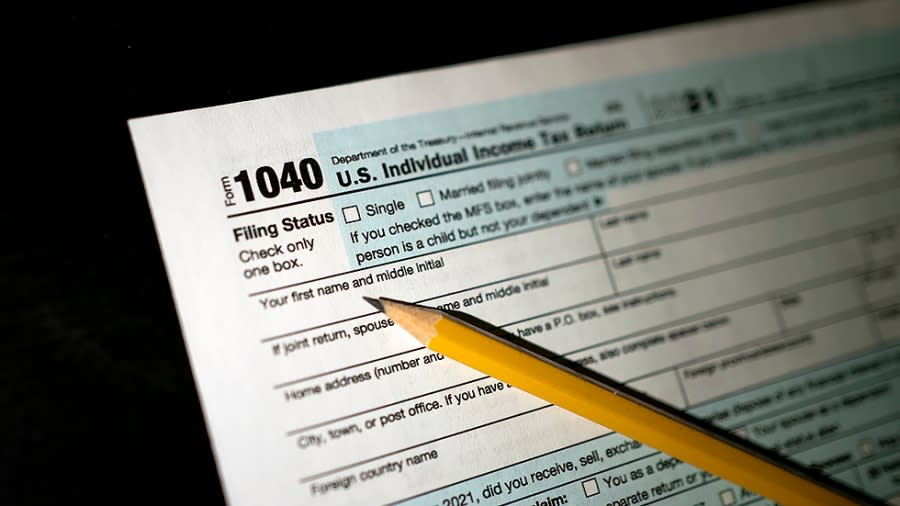 An IRS Form 1040 for 2021 is arranged for a photo illustration on Friday, April 15, 2022.