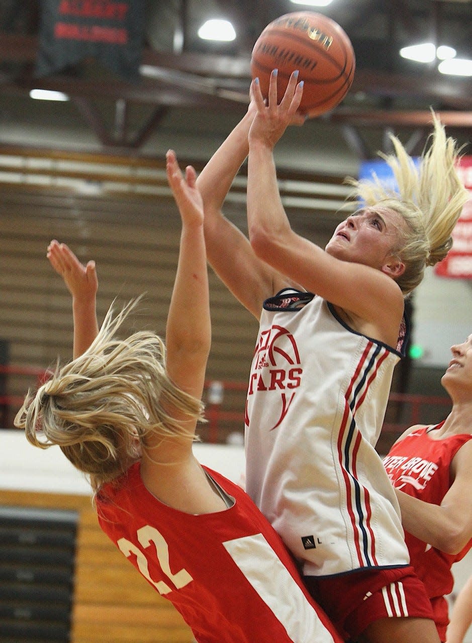 BNL junior Chloe Spreen gets sandwiched by a double-team and draws a foul Thursday during the final summer game of the season. Spreen had 24 points in a 60-42 win over Center Grove.