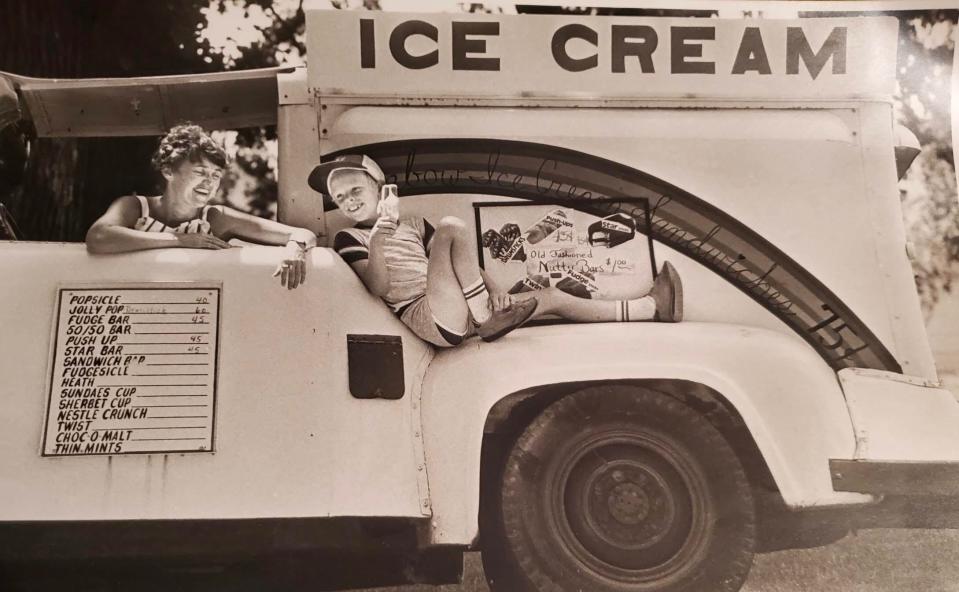 Kate Shaw of Spirit Lake, Iowa with her son Jeff, age 10, on their 1967 Ford F-250 ice cream truck. They're sampling the new Krazy Kate ice cream sandwich in 1985.